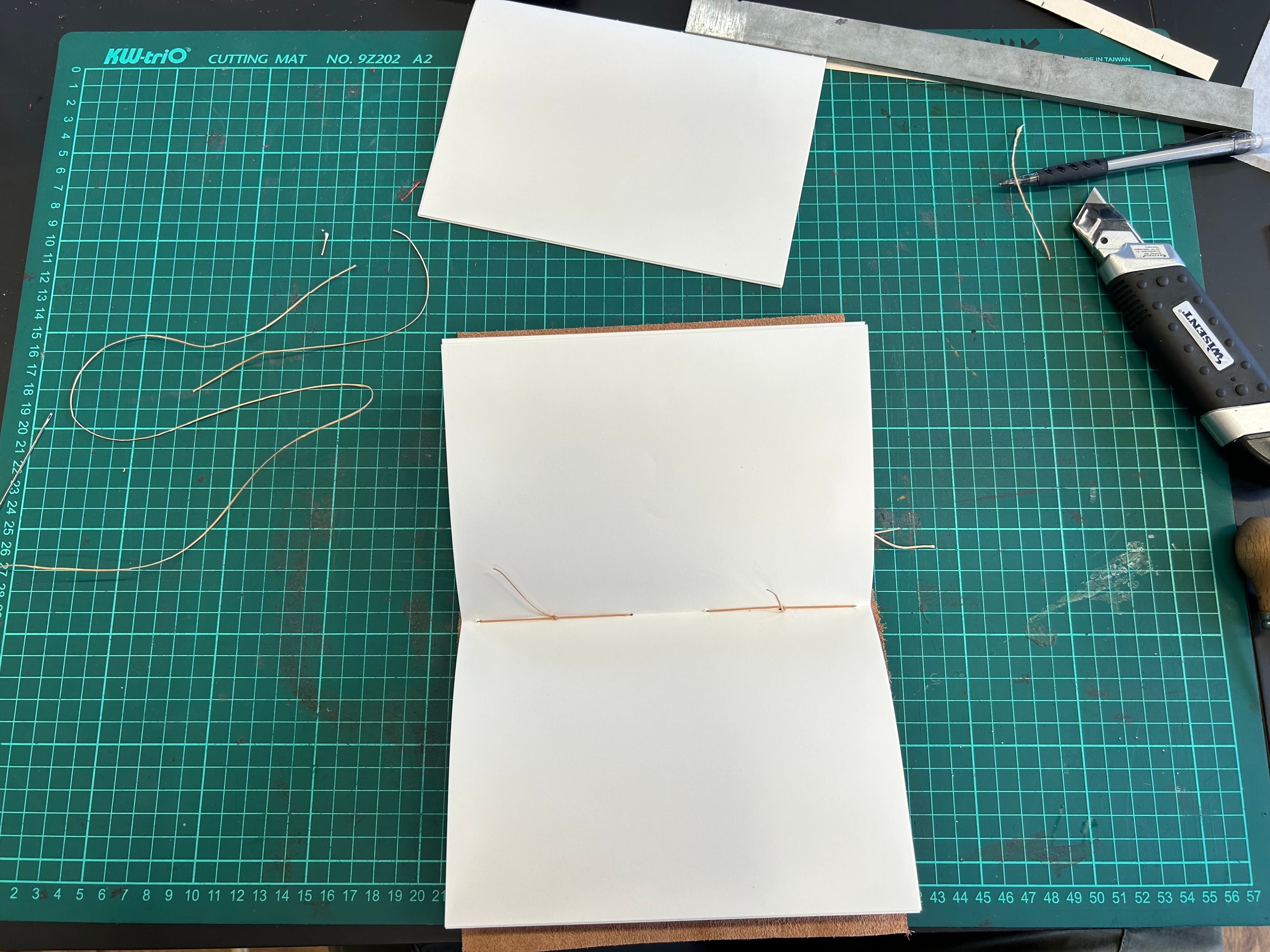 Stitching the gatherings to the cover
