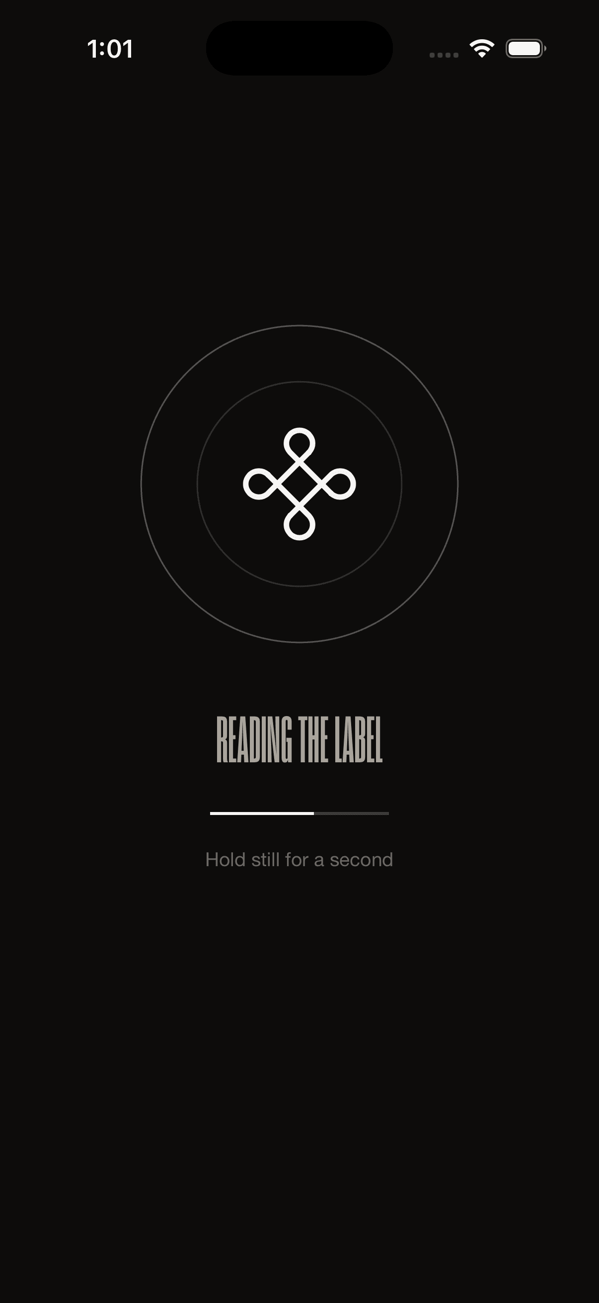 The real app: the label-reading state, with concentric rings around the knot glyph