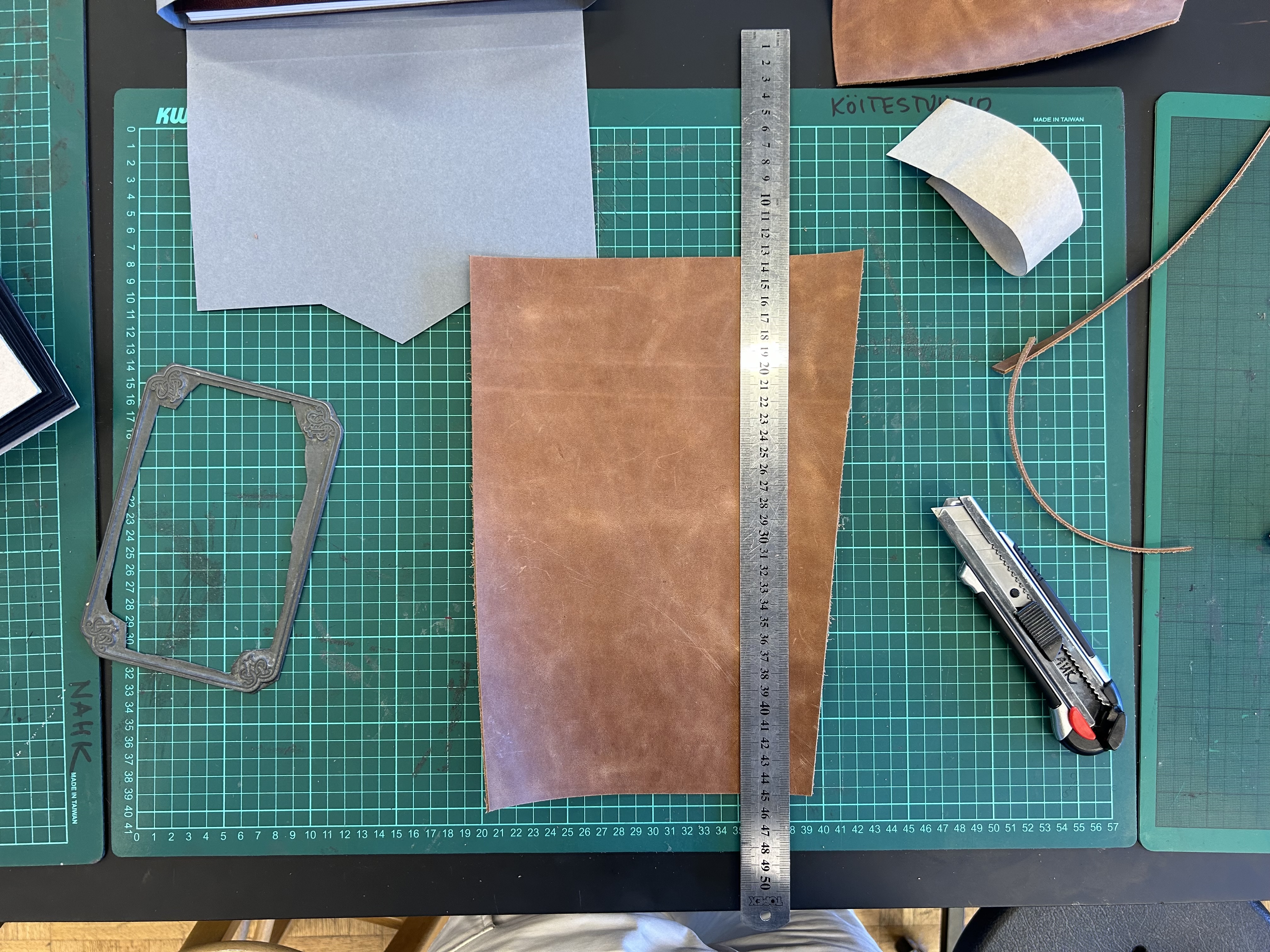 Cutting the leather for the cover to size
